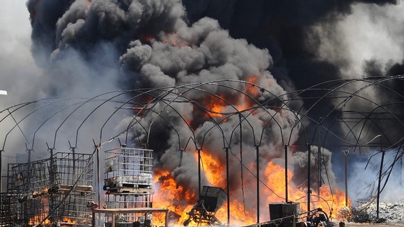 Heavy smoke as flames engulf a farm