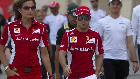 Ferrari Formula One driver Felipe Massa of Brazil walks in the pits