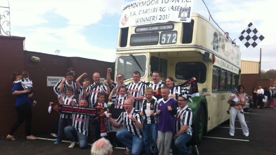 Fans get a quick picture before bus sets off.