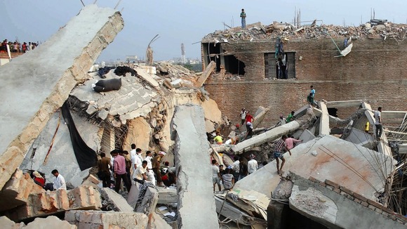 Rescue workers look for trapped garment workers