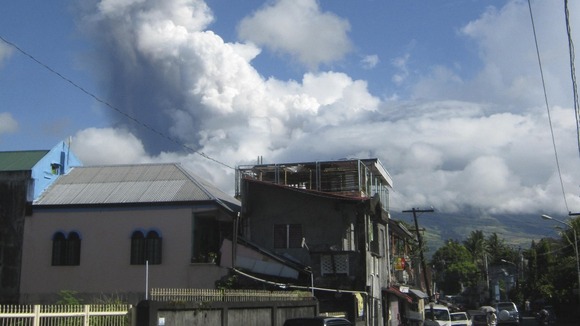 Smoke rises from the volcano