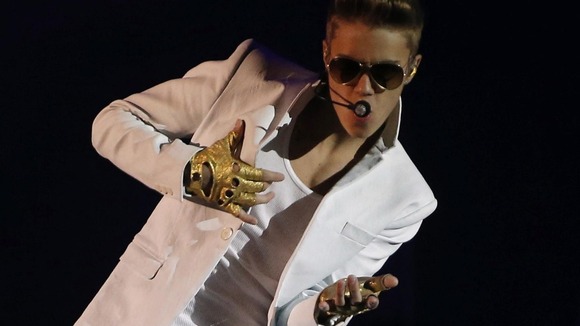 Justin Bieber performs in a concert at the Manchester Arena in Manchester, February 21, 2013