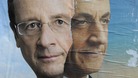 Official campaign posters Socialist Party winner Francois Hollande and his rival Nicolas Sarkozy 