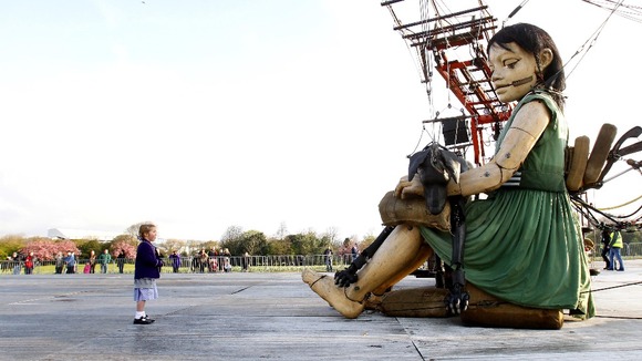 Emmy-Lou Hussin, aged 5, looks at the Little Girl Giant