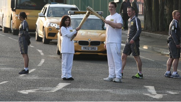 Two people holding torch