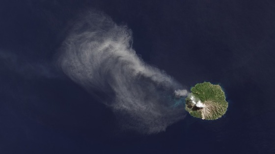 The satellite detected a white cloud of smoke and ash drifting northwest over the sea