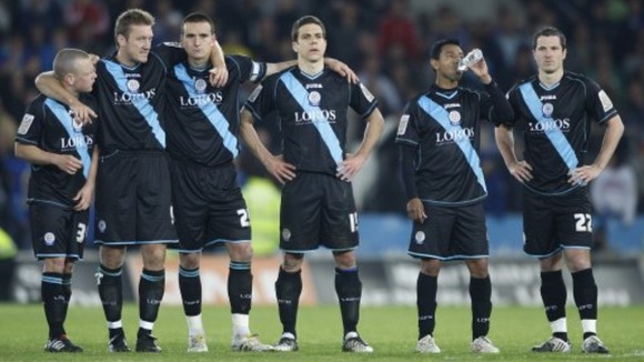 Leicester City players appear dejected after being knocked out of the play offs after the final whistle.