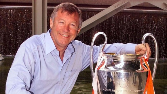 Sir Alex Ferguson with a trophy