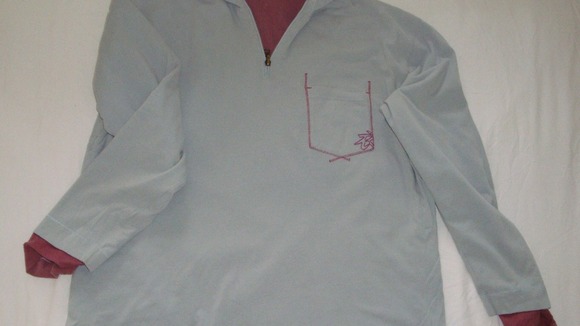 Replica sweatshirt worn by Luke on the evening he went missing, the top is reversible