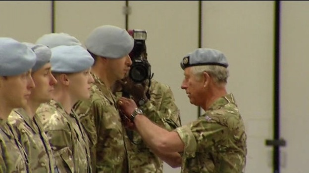 Prince Charles presenting service medals to soldiers who served in Afganistan