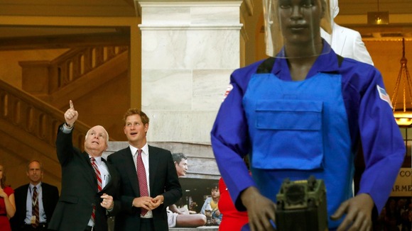 Senator John McCain (Ariz.) and Prince Harry at the Halo Trust exhibition.