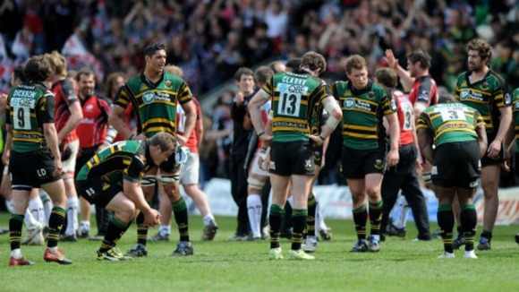 The Northampton players stand dejected on the final whistle