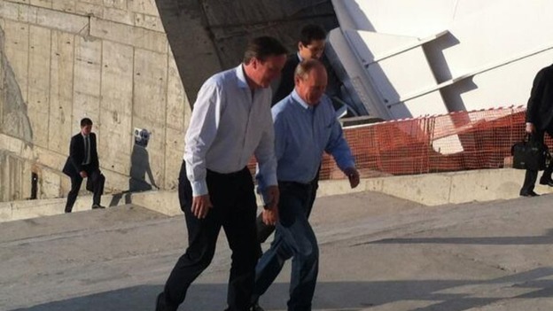 David Cameron (L) tours the Winter Olympic Stadium with Vladimir Putin