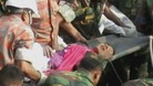 Reshma is carried away on a stretcher moments after being freed from the wreckage