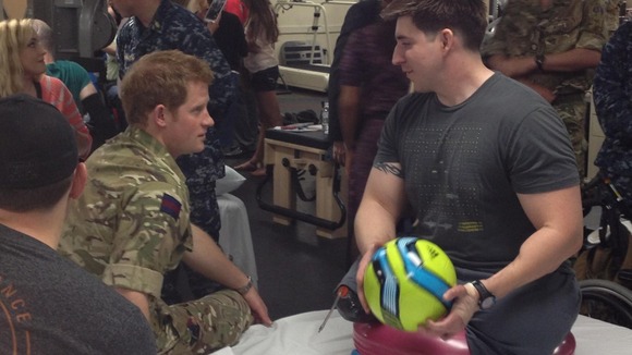 Prince Harry with US Army Staff Sergeant Tim Payne, who lost both his legs in Kandahar.