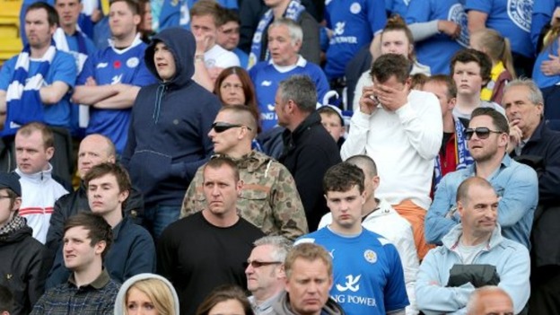 Leicester City fans look dejected in the stands after the final whistle