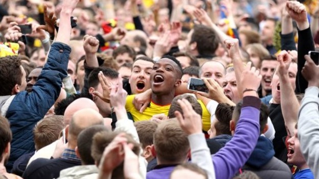 Watford's Nathaniel Chalobah is mobbed by home fans on the pitch after the final whistle