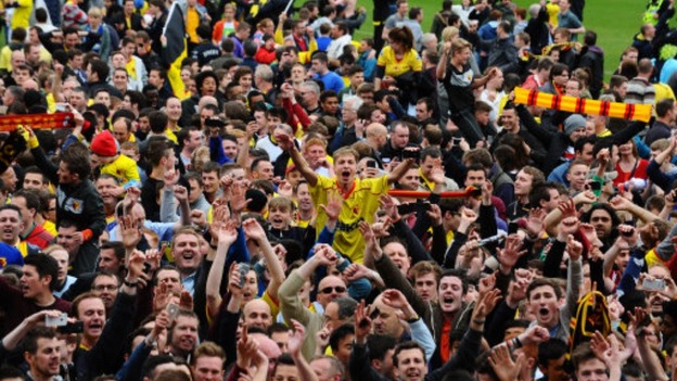 Watford fans on the pitch after the npower Football League Championship match at Vicarage Road.