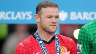 Wayne Rooney celebrates Manchester United winning the Premier League.