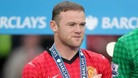 Wayne Rooney celebrates Manchester United winning the Premier League.