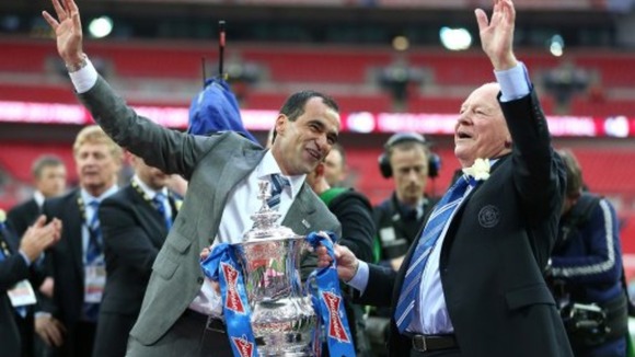 Martinez celebrates with chairman Dave Whelan and the FA Cup trophy, after their victory over Manchester City