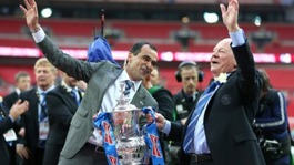 Martinez  celebrates with chairman Dave Whelan and the FA Cup trophy, after their victory over Manchester City 