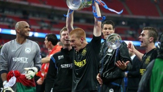Wigan Athletic winning goalscorer Ben Watson celebrates with the FA Cup trophy, after their victory over Manchester City 
