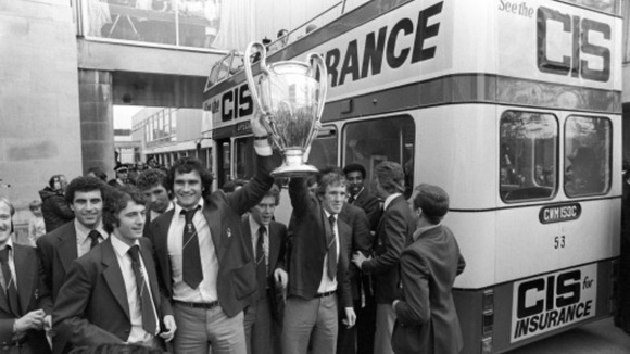 Nottingham Forest's Larry Lloyd, third left, and Ian Bowyer, third right, hold the European Cup aloft as they tour Nottingham