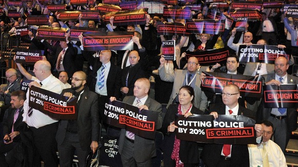 Delegates watch as Home Secretary Theresa May speaks at the 2012 Police Federation annual conference