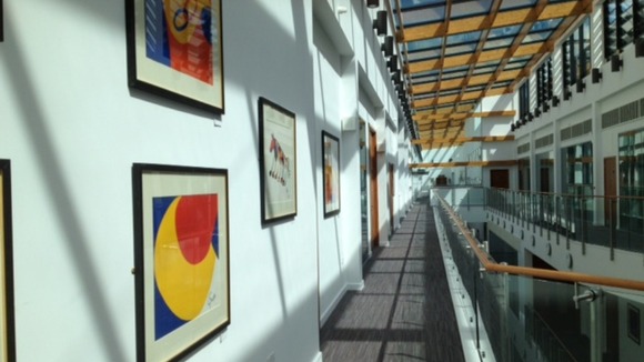 A wall of Alexander Calder art work on a 3rd floor mezzanine.