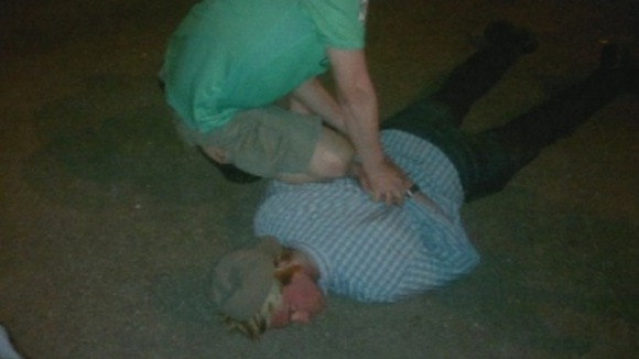 Photo purporting to show Ryan Fogle being handcuffed by Russian police