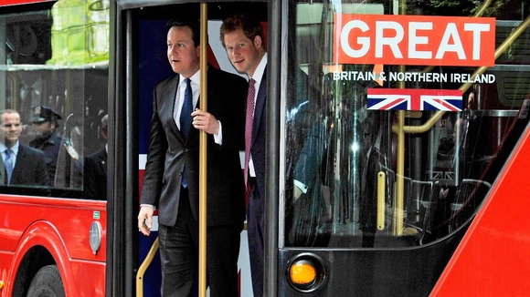 David Cameron and Prince Harry disembark the Routemaster bus