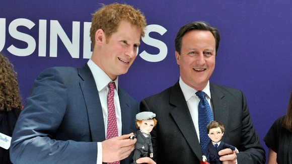 Prince Harry and the Prime Minister pose with their lookalike dolls