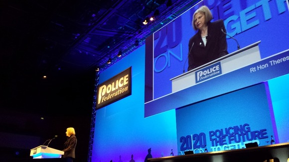 Theresa May addresses the conference