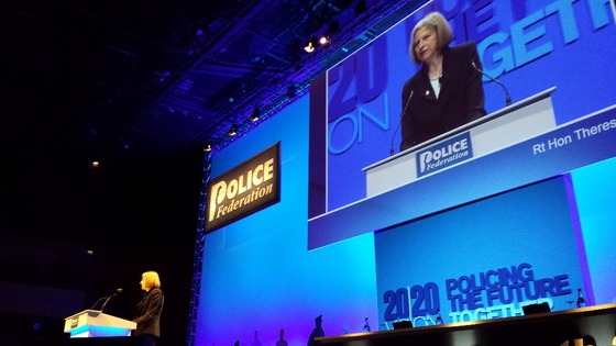 Theresa May addresses the conference 