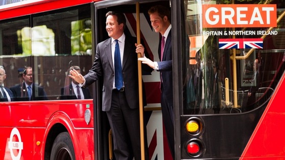 David Cameron and Prince Harry on the special edition bus