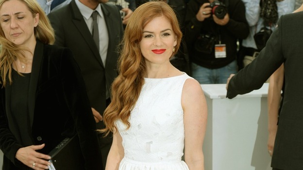 Isla Fisher poses for photographers in Cannes