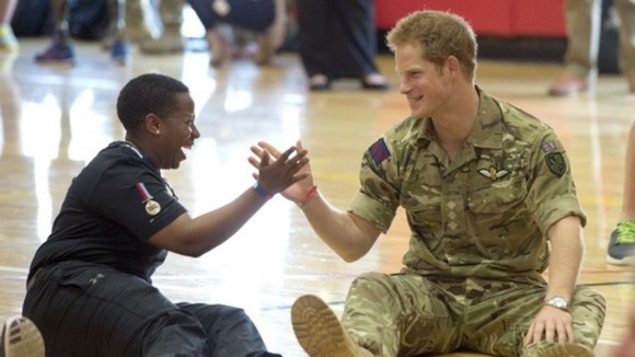 Prince Harry shakes hands with a soldier during a bout of 'Warrior Games'