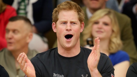 Prince Harry watches a seated volleyball exhibition match during the Warrior Games