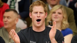 Prince Harry watches a seated volleyball exhibition match during the Warrior Games