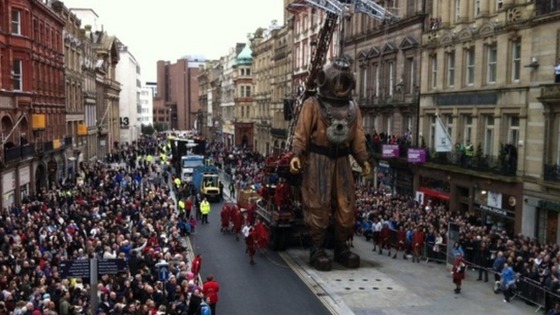 Giant Diver puppet walks through Liverpool city centre 