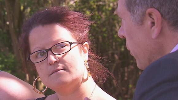 CU lady looks at man as he speaks
