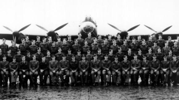 The 617 Squadron pictured in front of a Lancaster bomber