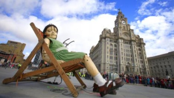Little girl giant sleeps under Liver building