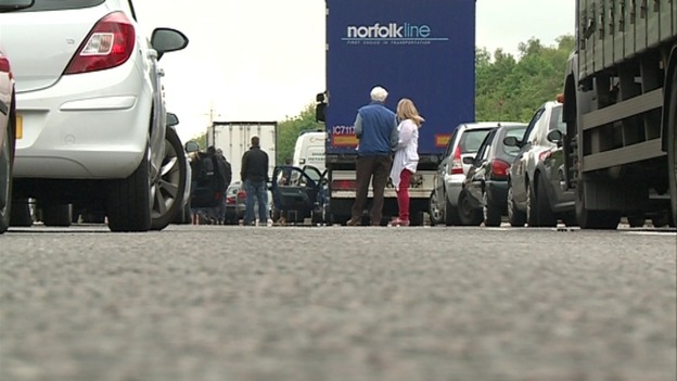 People out of their cars on the A45