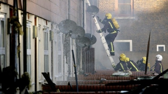 Firefighters tackle a blaze in Peckham, London. C