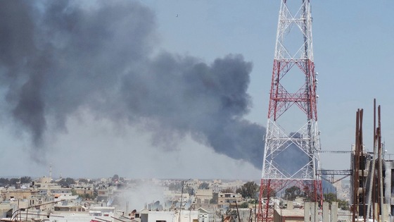 Smoke rises after what activists said was a missiles fired by Syrian Air Force fighters loyal to President Assad in Deraa on April 26. 