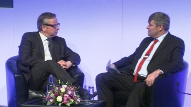 Education Secretary Michael Gove (L) speaks at the NAHT conference