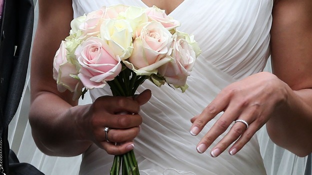 Jessica Ennis shows off her wedding ring and bouquet