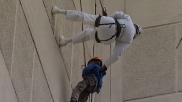 Pensioner abseils building